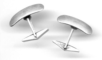 RIVET $100-sterling silver cufflinks with swiveling sanding disked planes (3/4" across)